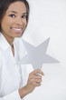African American Woman Holding SIlver Star