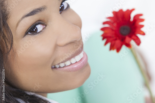 Photo: African American Woman With Red Flower African American Woman With Red Flower