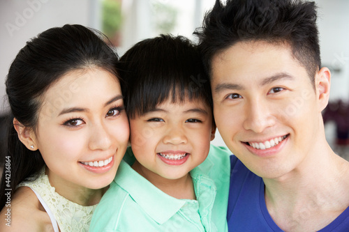 Photo: Head And Shoulders Portrait Of Chinese Family Together At Home Head And Shoulders Portrait Of Chinese Family Together At Home
