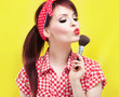Pin up girl applying blusher