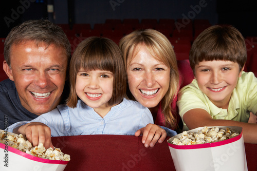 Photo: Family Watching Film In Cinema Family Watching Film In Cinema