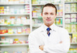 Photo: Confident pharmacy chemist man in drugstore Confident pharmacy chemist man in drugstore