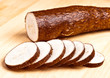sliced yuca on wooden base