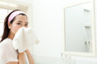 Foto: Beautiful young woman washing face Beautiful young woman washing face