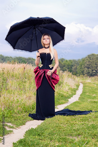 Photo: Beautiful woman in vintage dress Beautiful woman in vintage dress