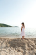 child look the sea on the hill