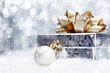 Photo: Christmas gift in falling snow Christmas gift in falling snow