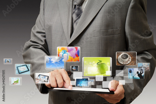 Photo: businessman using his digital tablet businessman using his digital tablet