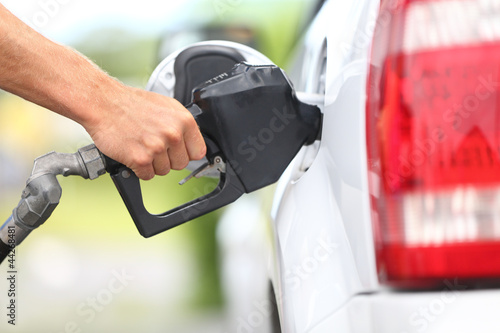 Photo: Pumping gas at gas pump Pumping gas at gas pump