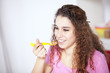 Young woman eating cereals