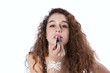 Woman applying lipstick