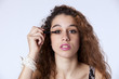 Woman applying the eyeliner