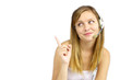 Beautiful woman pointing at copy space over white background