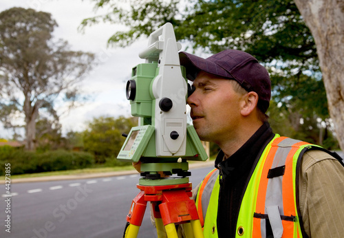 Photo: Surveyor checks his work Surveyor checks his work
