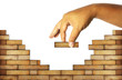 hand building a brick wall ;build a house concept