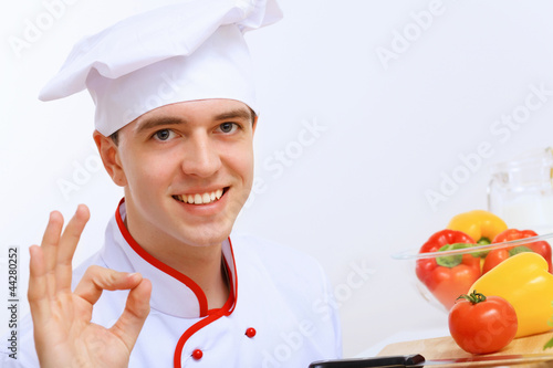 Photo: Young cook preparing food Young cook preparing food