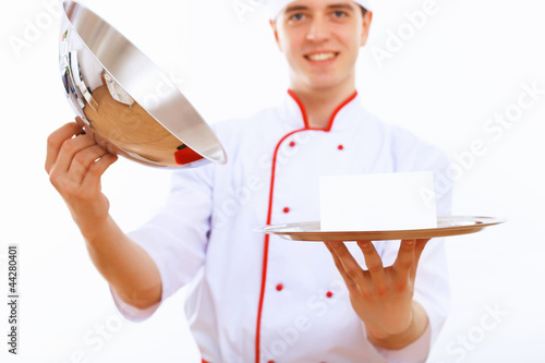 Photo: Cook holding an empty tray Cook holding an empty tray