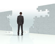Photo: Businessman with a puzzle pieces Businessman with a puzzle pieces