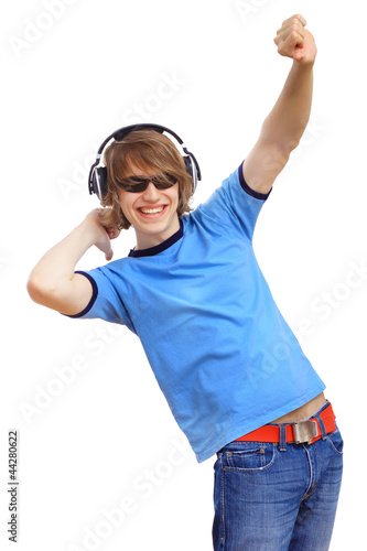 Photo: Happy smiling young man dancing Happy smiling young man dancing