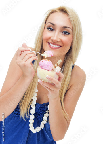 Photo: Happy woman eating ice cream,isolated on white Happy woman eating ice cream,isolated on white