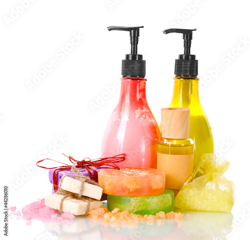 Photo: Bottles , soaps and sea salt isolated on white Bottles , soaps and sea salt isolated on white