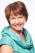 Beautiful fashionable smiling mature woman in turquoise costume