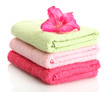 bright towels and flower isolated on white