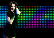 Foto: Fashion expressive girl dancing at disco light Fashion expressive girl dancing at disco light