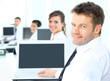 Portrait of a happy man entrepreneur displaying