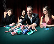 Poker player going "all in" pushing his chips forward