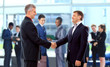 Handshake in front of business people