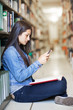 Photo: Hispanic student texting Hispanic student texting