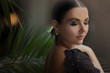 Fashion portrait of beautiful young woman with make up