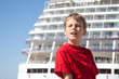 little boy closed eyes against background ship