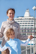 mother daughter smiling near ship in port of Tallinn