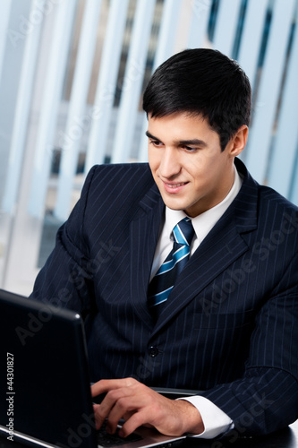 Photo: Businessman working with laptop Businessman working with laptop