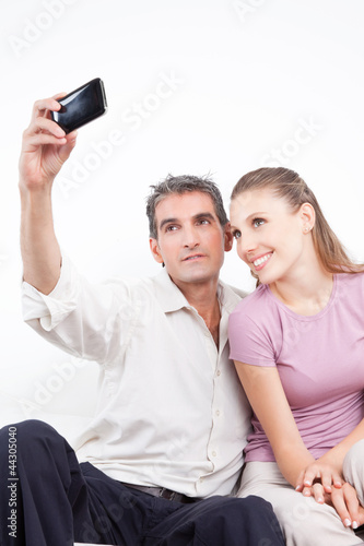 Photo: Couple Taking Self Portrait Couple Taking Self Portrait