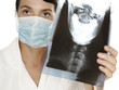 Photo: coctor holding a X-ray image of a skull coctor holding a X-ray image of a skull