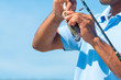 Fisherman Catches a Perch Fish