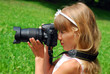 young girl with digital camera