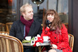 Happy couple having a date in cafe