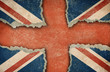Illustration: Ripped cardboard in form of British flag Ripped cardboard in form of British flag