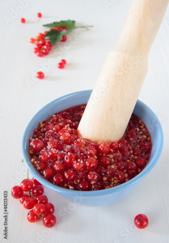 Photo: Crush red currants and sugar Crush red currants and sugar