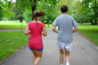 caucasian couple   jogging in summer park.