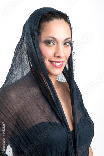 Photo: Veiled woman isolated against white background. Intense portrait Veiled woman isolated against white background. Intense portrait