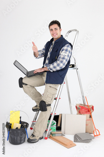 Photo: Tiler surfing the Internet whilst at work Tiler surfing the Internet whilst at work