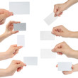 Hands hold business cards on white background