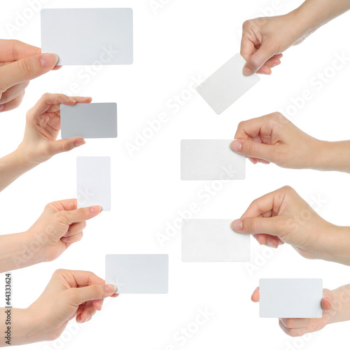 Photo: Hands hold business cards on white background Hands hold business cards on white background