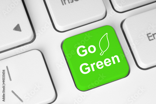 Photo: Go green button on keyboard background Go green button on keyboard background