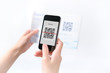 Woman scanning QR code in the magazine